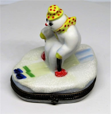 LIMOGES BOX - CHRISTMAS - SNOWMAN/SNOWLADY WITH SCARF & HAT SKIING TO NORTH POLE
