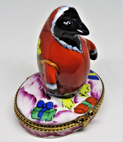 LIMOGES BOX- CHRISTMAS - WHIMSICAL PENGUIN IN A SANTA CLAUS SUIT - SACK OF GIFTS