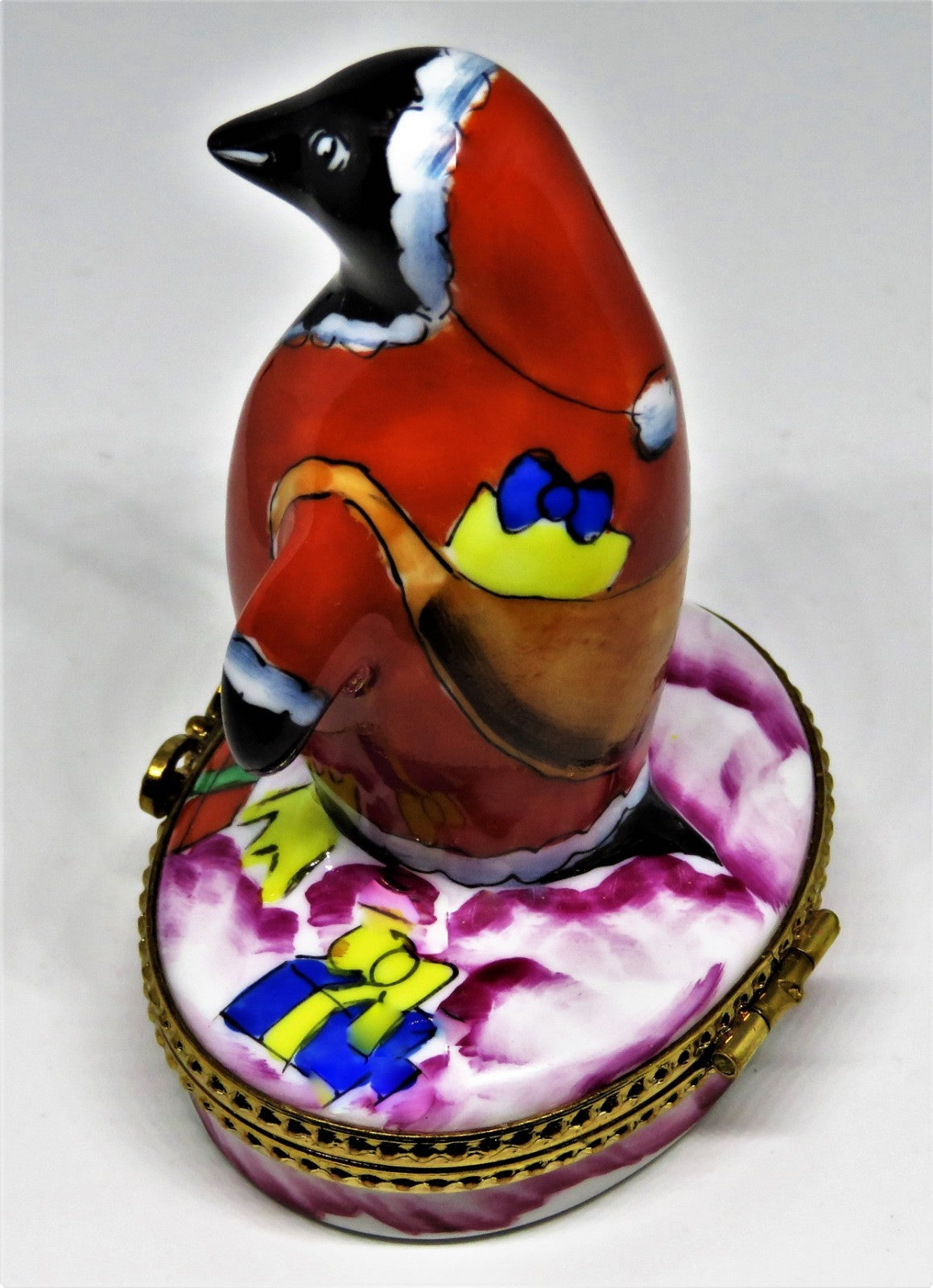 LIMOGES BOX- CHRISTMAS - WHIMSICAL PENGUIN IN A SANTA CLAUS SUIT - SACK OF GIFTS