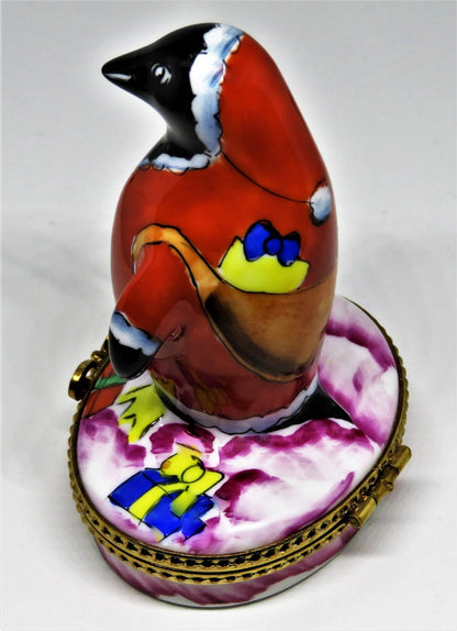 LIMOGES BOX- CHRISTMAS - WHIMSICAL PENGUIN IN A SANTA CLAUS SUIT - SACK OF GIFTS